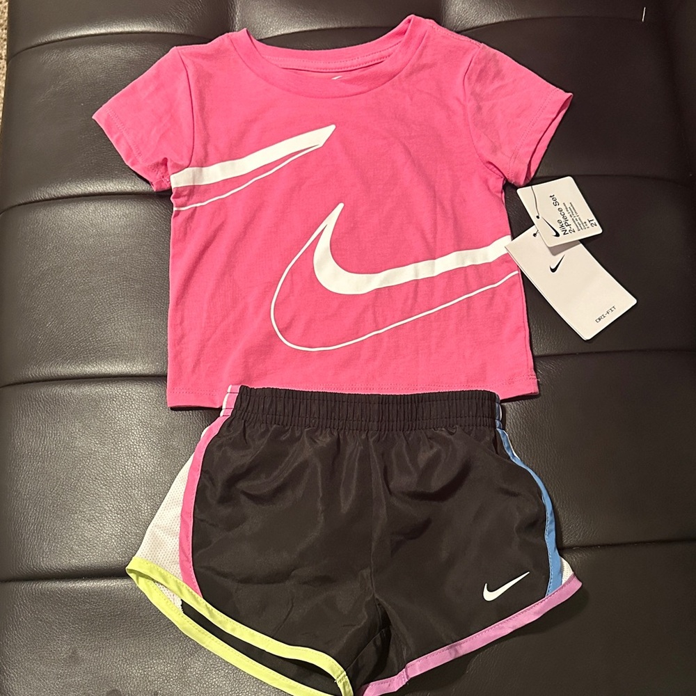 Nike Pink Tee and Black Shorts with White Swoosh